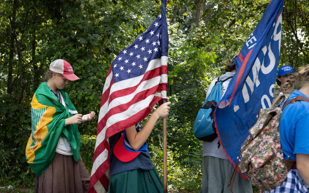 Supporters of former US president Donald Trump wait for his arrival outside the Fulton County Jail in Atlanta, Georgia, on 24 August, 2023.