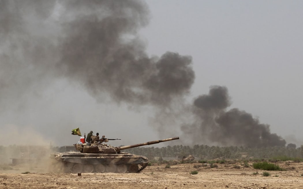 Iraqi government forces advance towards the centre of Saqlawiyah, north-west of Fallujah, to regain control of the area from the Islamic State group.