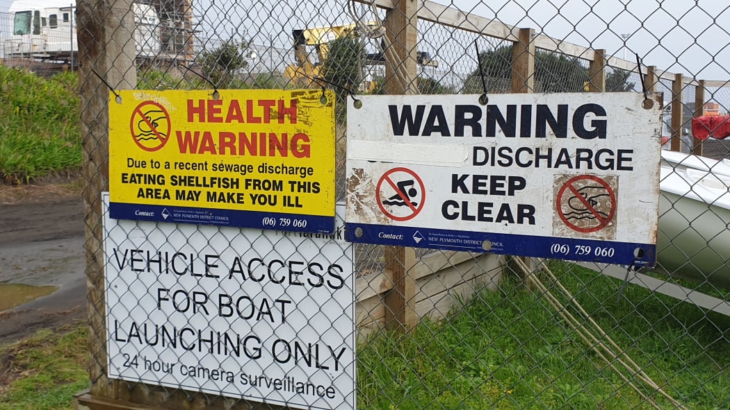 Warning signs have been put up at a New Plymouth beach and residents of a nearby suburb told not to flush their toilets after a sewage spill in the city last night.