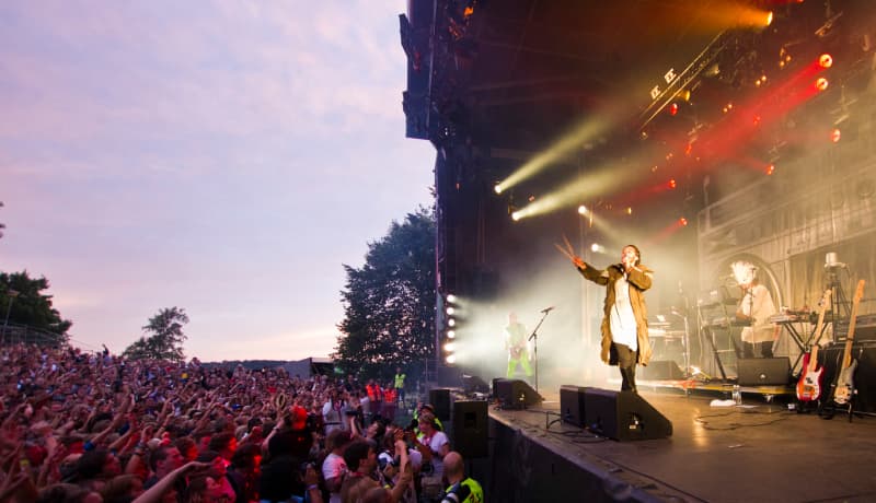 People attend the concert of Svein Berge and Torbjorn Brundtland, from the Norwegian electronic music duo Royksopp, during the Slottsfjell festival in Tonsberg on July 14, 2011.
