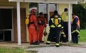 Firefighters outside Niue's BCN studios