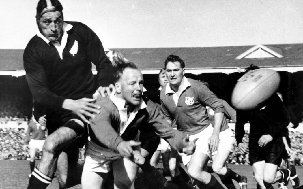 Tiny Hill tackles Lions player Dickie Jeeps during the third rugby union test match between the All Blacks and British and Irish Lions, 1959.