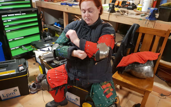 Dayna Berghan-Whyman getting kitted up to fight.