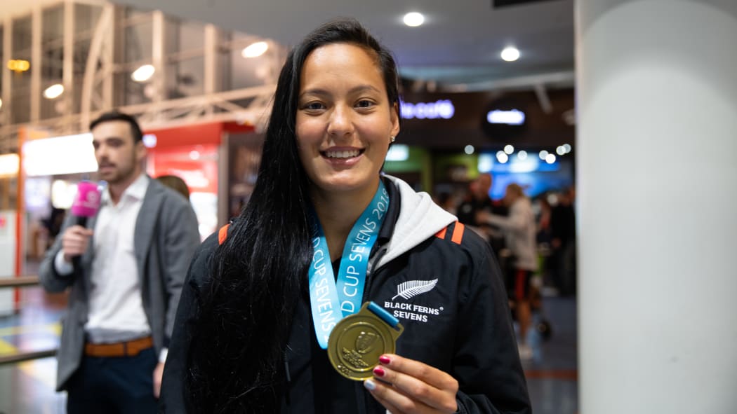 Tyla Nathan-Wong arrives back home with her Black Ferns team members in New Zealand after defending their sevens world cup title in San Francisco.