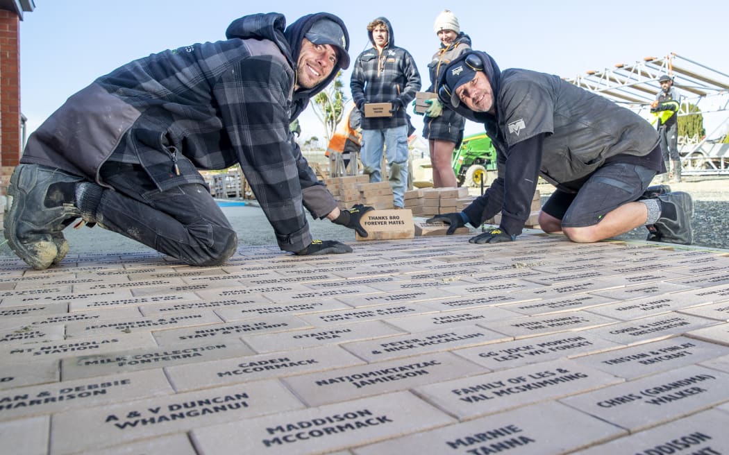 Ryan Godden, left, Seth Maze, Aimee Wood and Jason Maze from Maze landscapes Ltd flew from Taupo to help lay the bricks for the Southland Charity Hospital pathways.