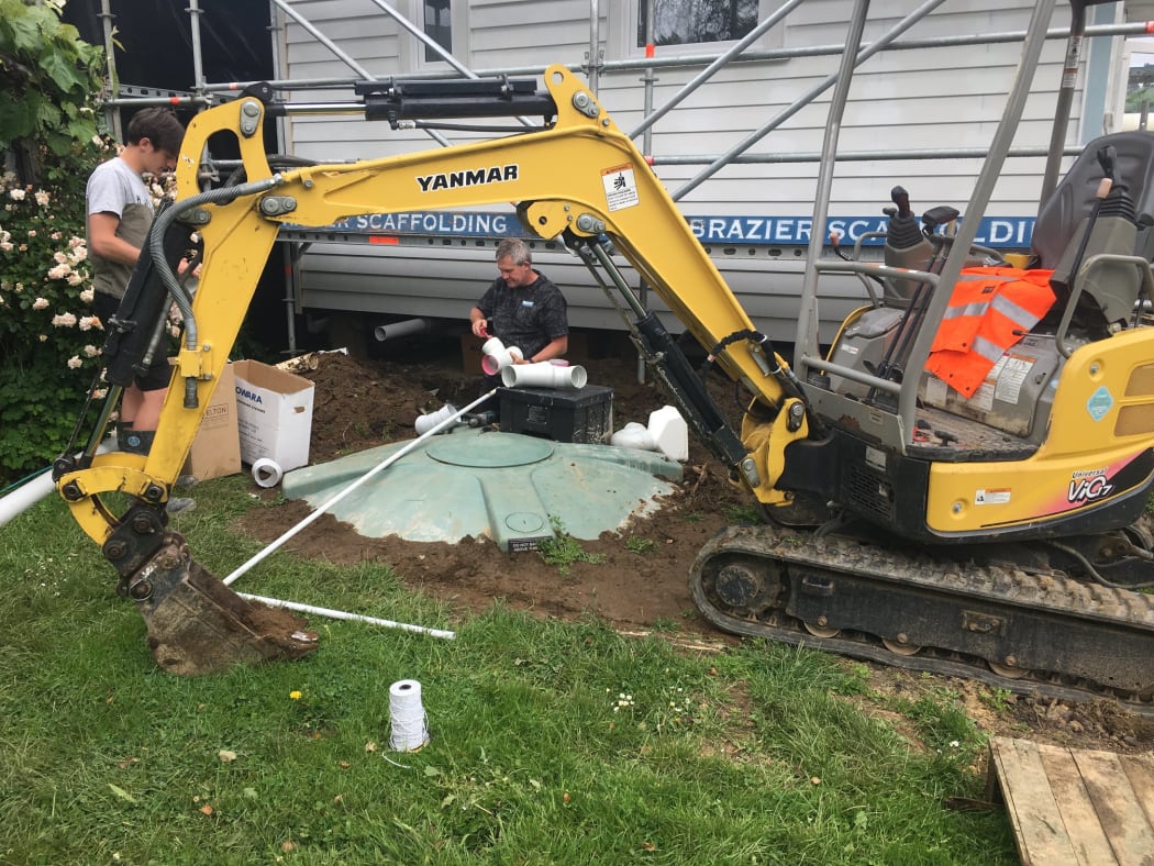 The septic tank being installed. The tank uses worms rather than pumps for aeration.