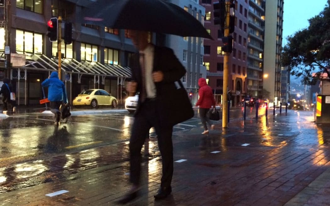 Wet commuters in the capital.