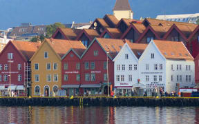 Photo of row of colourful buildings beside the water, Bergen, Norway