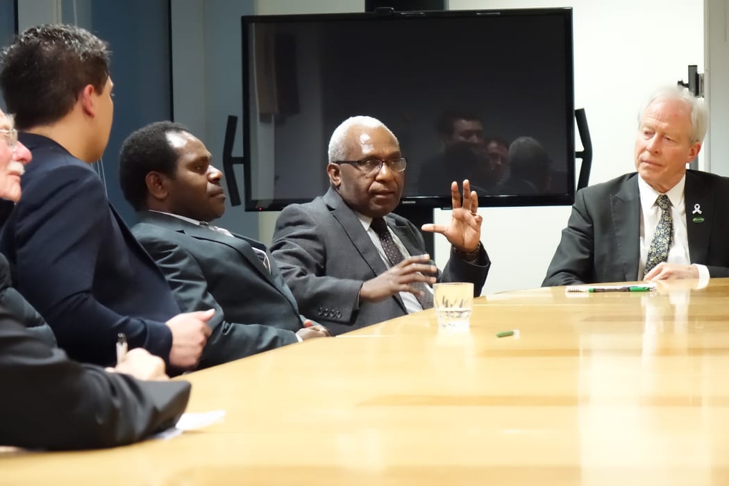 The secretary-general of the United Liberation Movement for West Papua, Octo Mote (centre) and the Movement's Pacific regional ambassador Akaboo Amatus Douw to his right, talk to New Zealand MPs, Wellington 2015.