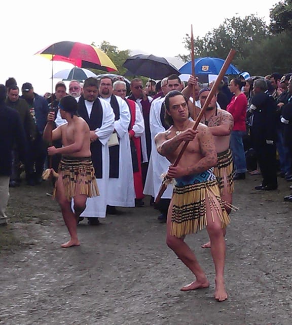 The funeral procession leaves the marae.