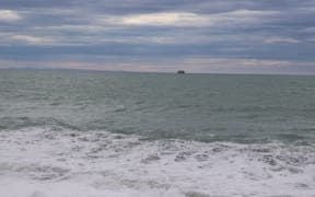 A logging ship, Ken Rei, anchored in Napier on Monday morning, awaiting official advice after a Covid-19 scare.