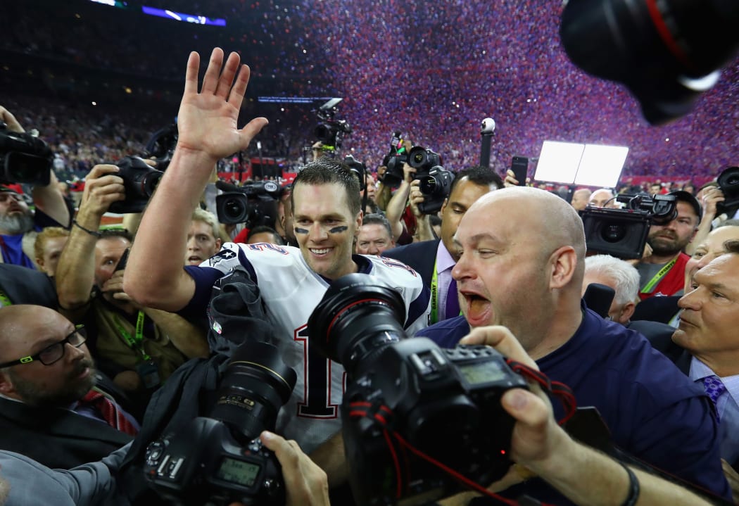 Tom Brady of the New England Patriots celebrates after defeating the Atlanta Falcons 34-28 in overtime of Super Bowl.