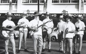 Nick Nicholson and the Neketini Brass outside the Christchurch NZBC studio, 1968.