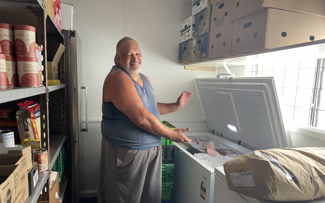 Owen Cooper shows the freezer where he stores ingredients for Ranui Baptist Community Care Trust's community meals.