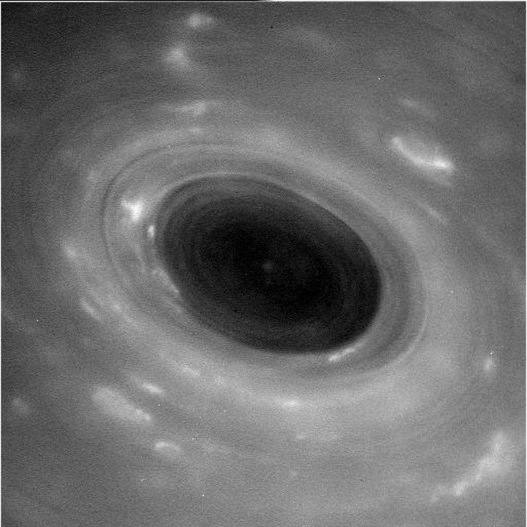 An image sent from the Cassini space probe dives through narrow gap between Saturn & its icy rings