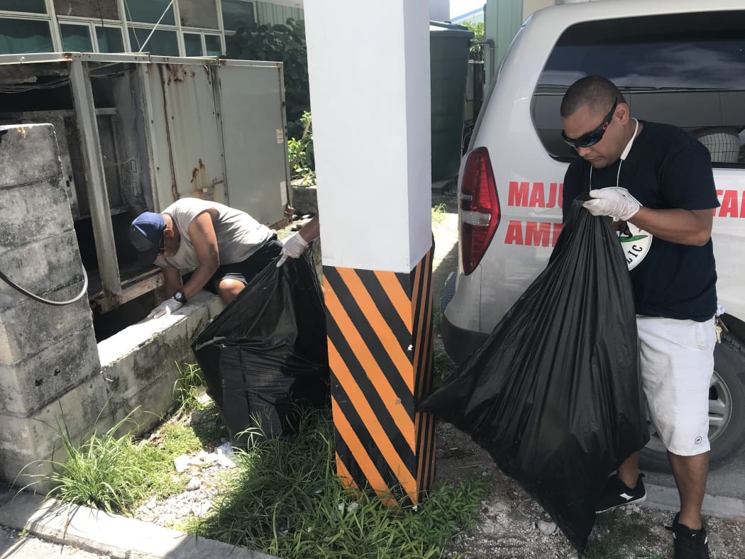 Ministry of Health staff led a grounds cleanup Saturday, August 17 to rid the main hospital of mosquito breeding locations.