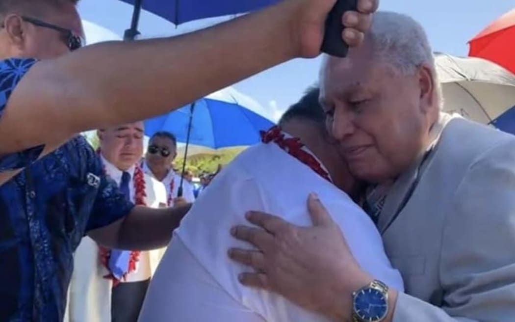 Samoa's Head of State embracing former Samoa PM, Tuilaepa Sailele Malielegaoi.