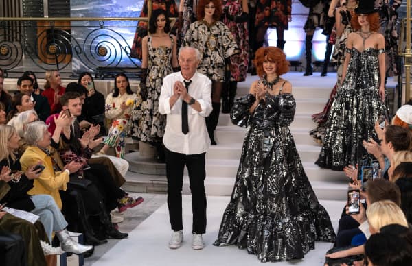 Irish-American designer Paul Costelloe acknowledges the applause after presenting his Autumn/Winter 2023 collection on the opening day of the London Fashion Week, in London, on February 17, 2023.