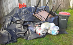 Some of the family's possessions dumped in their front yard.