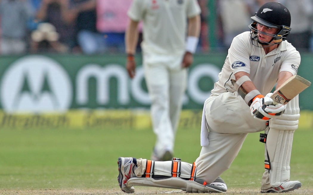 Tom Latham plays the sweep shot on day two in Kanpur.