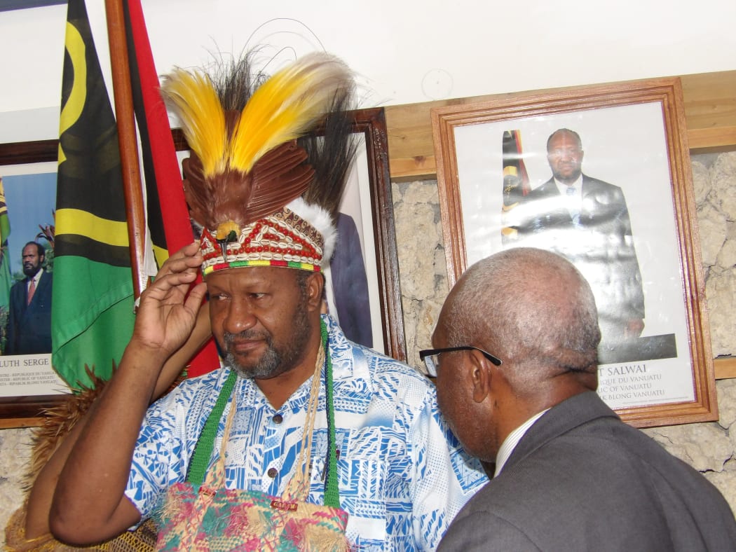 Vanuatu prime minister Charlot Salwai accepts traditional head dress from the United Liberation Movement for West Papua.