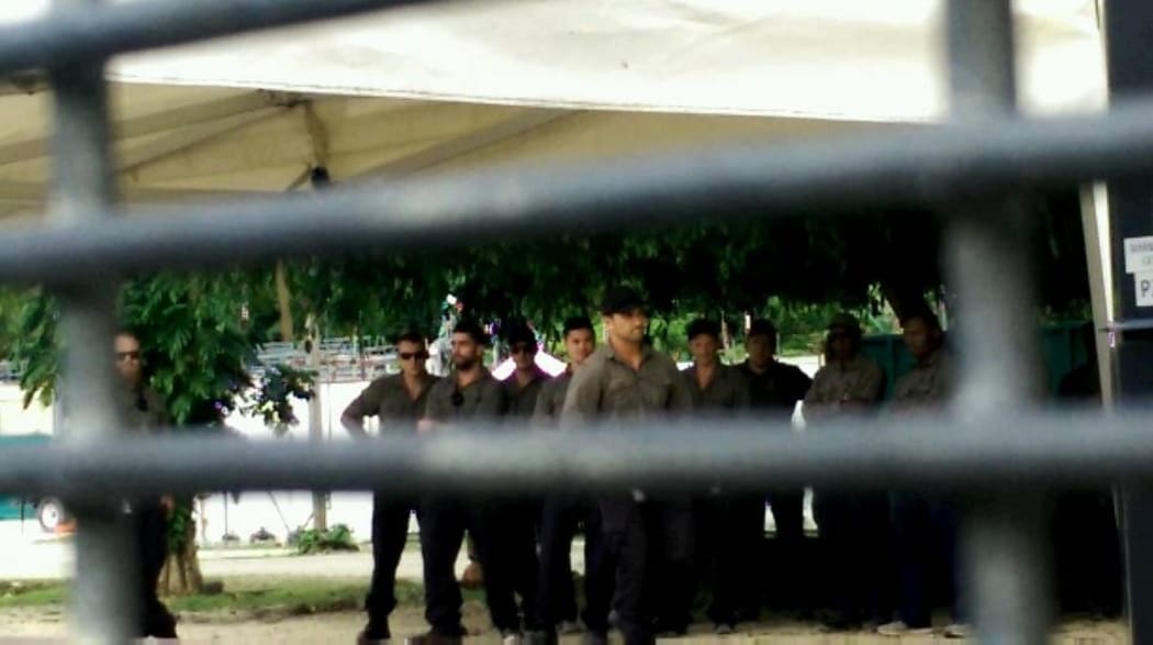 Officials gathered at the gate of Foxtrot compound.