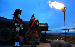 Army Cadet Sergeant Ciaran Cook (L) and Army Cadet Callum Lowther (R) attend a ceremony for the beacon lighting at Edinburgh Castle, in Edinburgh, on June 2, 2022, as part of Queen Elizabeth II's platinum jubilee celebrations. - More than 2,800 beacons are lit at Buckingham Palace and across the UK, including atop the four highest peaks, as well as on the Channel Islands, the Isle of Man, and British Overseas Territories. Flaming tributes will be seen in 54 Commonwealth capitals across five continents, from Tonga and Samoa in the South Pacific to Belize in the Caribbean.