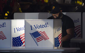 Michael Jones casts his ballot at a polling location inside Pittsburgh Bureau of Fire Engine Company #15 house in the Lincoln-Lemington-Belmar neighborhood of Pittsburgh, Pennsylvania, November 5, 2024. (Photo by Rebecca DROKE / AFP)