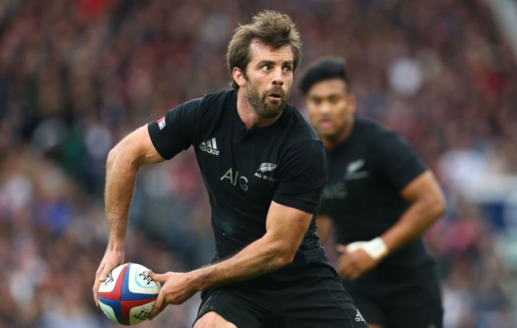 The All Blacks centre Conrad Smith in action against England.