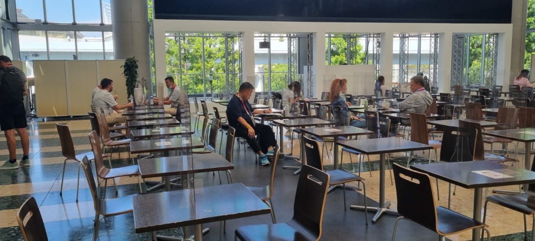 All dining hall tables are separated by clear perspex.