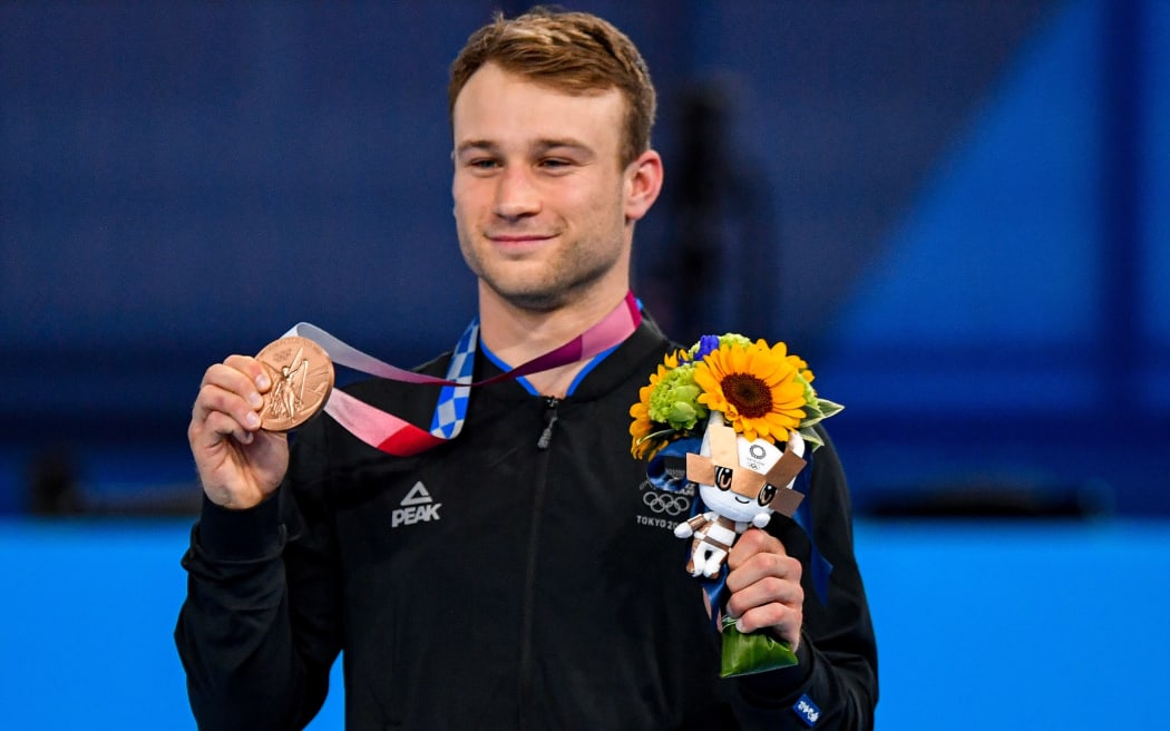 Dylan Schmidt with his bronze medal at Tokyo 2020 Olympic Games Trampoline Gymnastics at the Ariake Gymnastics Centre. Tokyo, Japan, Saturday 31 July 2021.