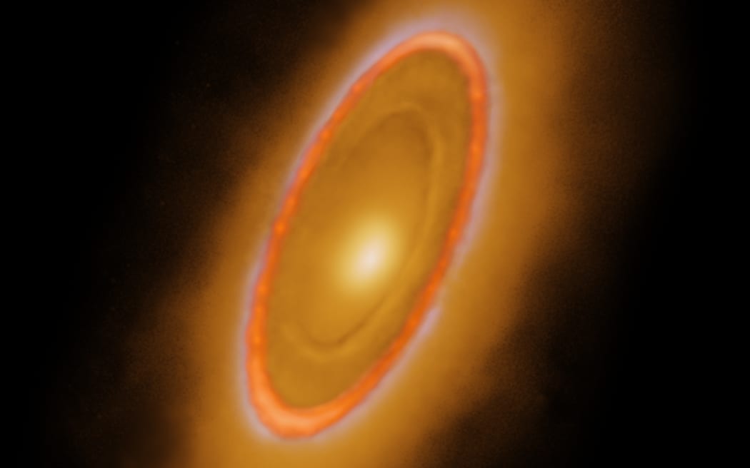 This image of the dusty debris disk surrounding the young star Fomalhaut is from Webb’s Mid-Infrared Instrument (MIRI). It reveals three nested belts extending out to 14 billion miles (23 billion kilometers) from the star. The inner belts were revealed by Webb for the first time.