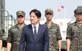 Taiwanese President Lai Ching-te arrives at a naval base in Taoyuan on October 18, 2024. (Photo by I-Hwa CHENG / AFP)