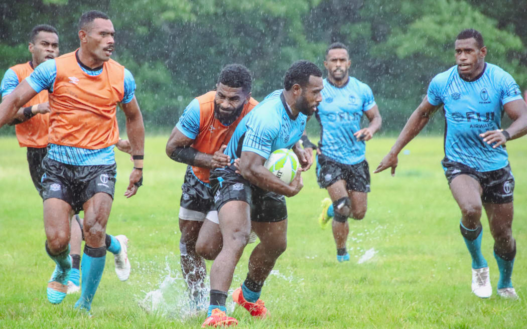 Members of the Fiji men's sevens team training in the rain in Suva, in preparation for the Perth 7s tournament. Photo: Fiji Rugby
