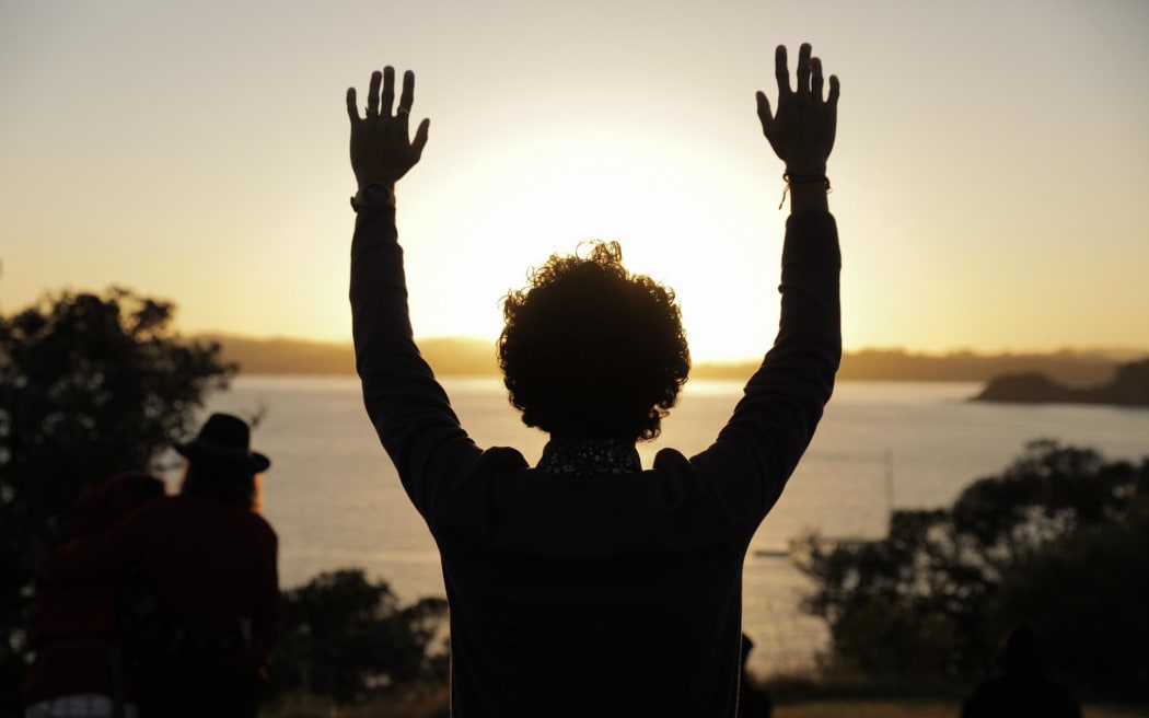 The sun rises over the Treaty Grounds in Waitangi on Waitangi Day 2024.