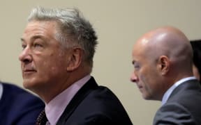 SANTA FE, NEW MEXICO - JULY 10: Actor Alec Baldwin (L) and and attorney Luke Nikas listen during his hearing at Santa Fe County District Court on July 10, 2024 in Santa Fe, New Mexico. Baldwin is facing a single charge of involuntary manslaughter in the death of cinematographer Halyna Hutchins on the set of the film "Rust".   Ross D. Franklin - Pool/Getty Images/AFP (Photo by POOL / GETTY IMAGES NORTH AMERICA / Getty Images via AFP)