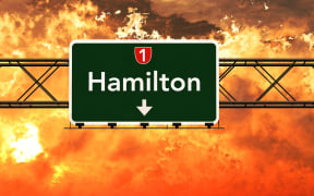Hamilton New Zealand Highway Sign in a Breathtaking Sunset Sunrise 3D Illustration
