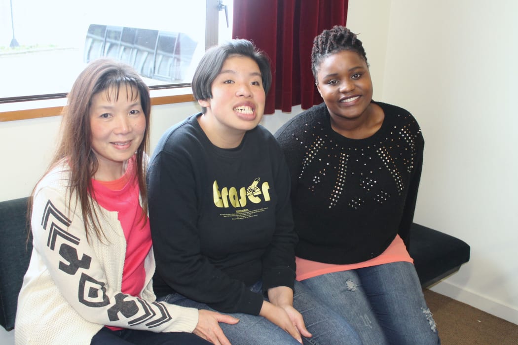 A photo of Tansy Ken, her daughter, Jennifer and a trainee carer, Nelta Jachi.