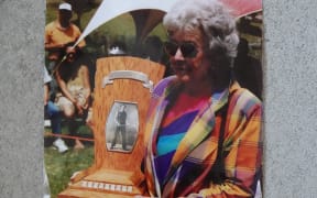The late Gwen Daly with the Mick Griffin Memorial Trophy, named in honour of her axeman father, in a photo taken around 2011.