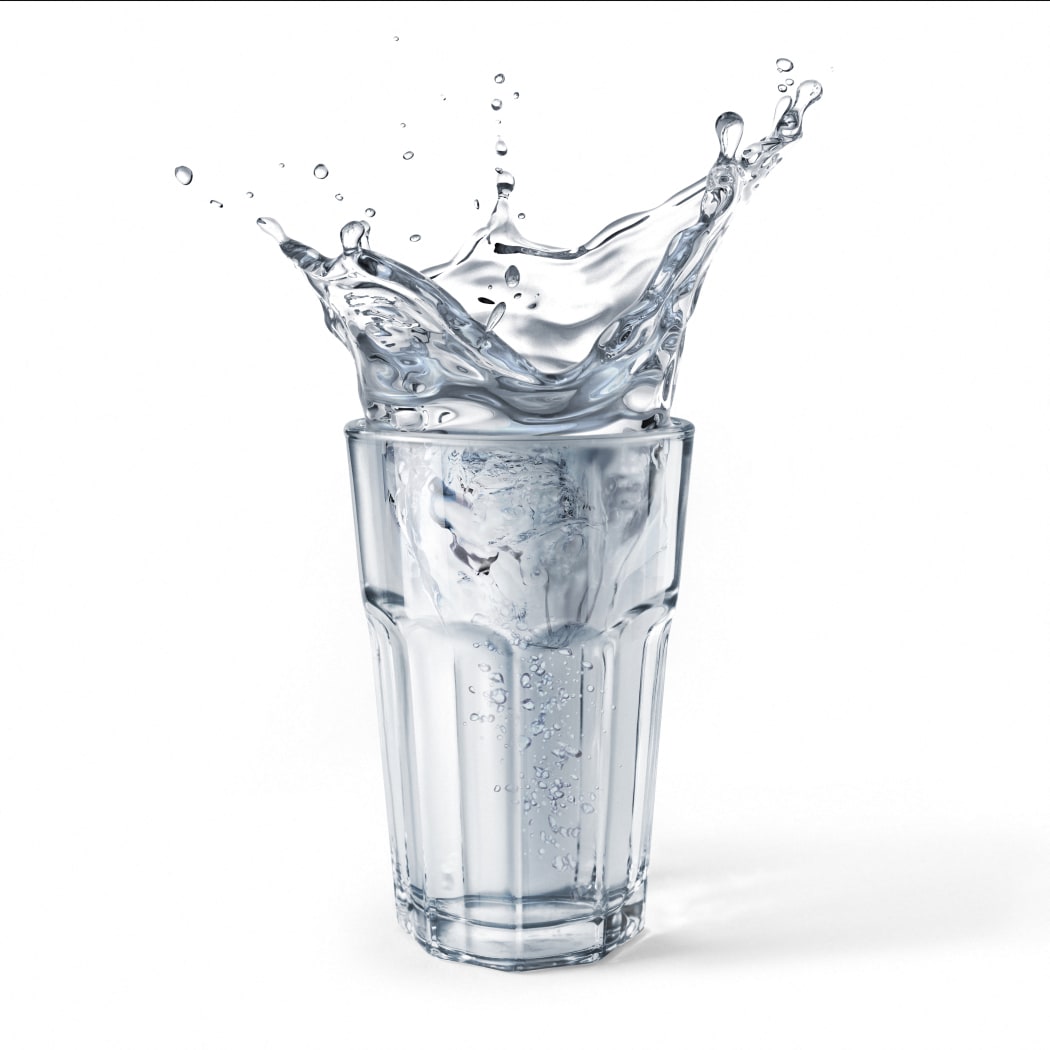 Glass full of water with splash. Isolated on white background. (Photo by LEONELLO CALVETTI/SCIENCE PHOTO / LCL / Science Photo Library via AFP)