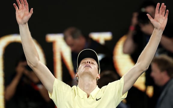 Italy's Jannik Sinner celebrates victory over Germany's Alexander Zverev after their men's singles final match on day fifteen of the Australian Open tennis tournament in Melbourne on January 26, 2025. (Photo by Martin KEEP / AFP) / -- IMAGE RESTRICTED TO EDITORIAL USE - STRICTLY NO COMMERCIAL USE --