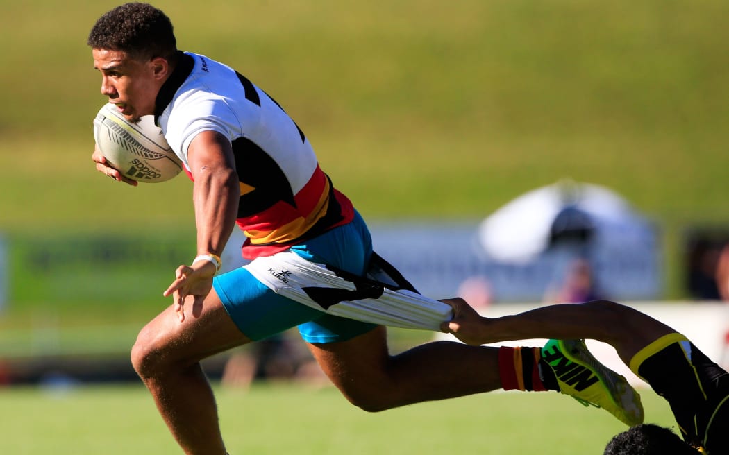 Waikato's Isaac Te Tamaki gets tackled by the shorts. Day 2, National Sevens, Rotorua, 2015.