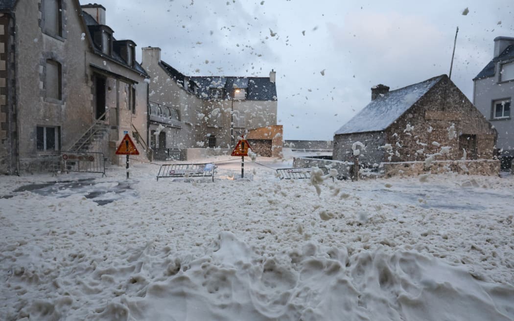 This photograph shows foam in the street of Penmarc'h, western France, on November 2, 2023, as the storm Ciaran hits the region. Much of northwestern Europe went on high alert on November 1, 2023 as a storm dubbed Ciaran threatened to bring gale-force winds and extreme rainfall to the region. (Photo by FRED TANNEAU / AFP)