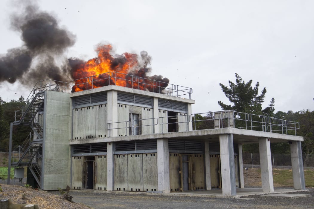 An explosion is set off to mark the opening of the SAS' new training facility in Papakura, Auckland.