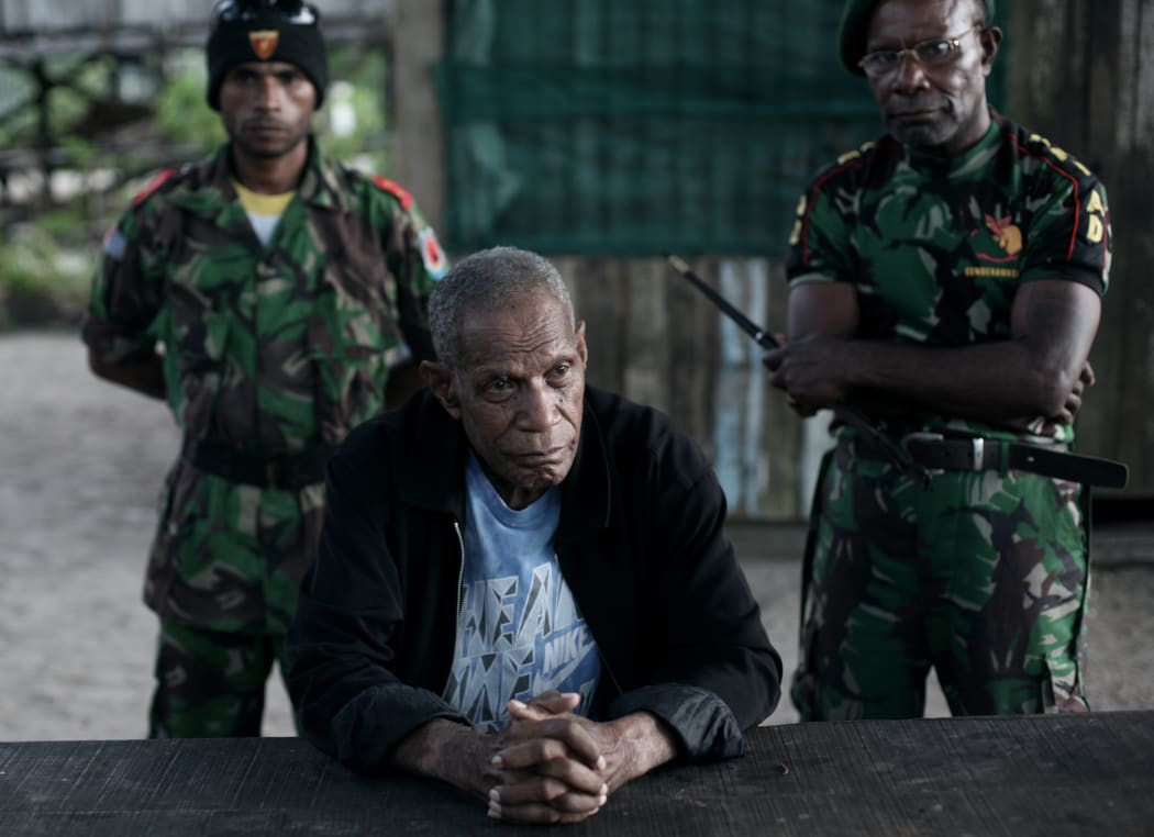 General Richard Joweni of the OPM (Free Papua Movement) posing with bodyguards at the OPM headquarters in the jungle of West Papua.