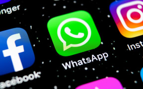 WhatsApp, Facebook and Instagram aps on an Apple iPhone X smartphone screen close-up.