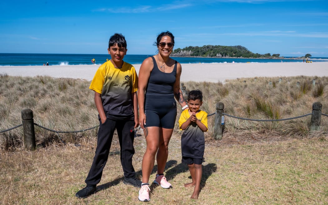 Summer Kerr with her sons Halo and Astore Taoho. She plans to do 12 climbs.