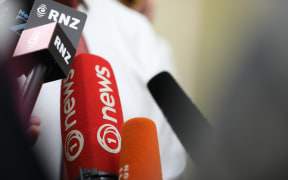 A bouquet of microphones greets Labour MP Andrew Little as he makes his way into his party’s Tuesday morning caucus meeting.