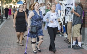 Boston Marathon Bombing victim Erika Brannock, centre, arrives at the sentencing of Boston Marathon Bomber Dzhokhar Tsarnaev.
