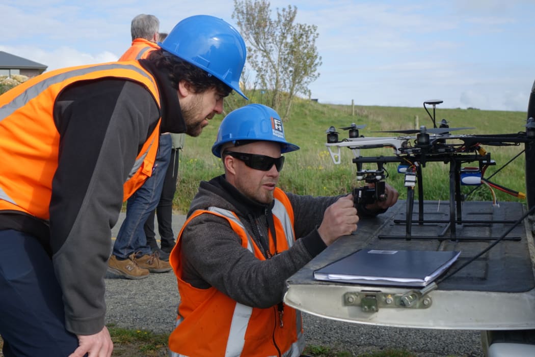 Fulton Hogan Dunedin laboratory manager Sean Connaughton, left, and drone operator Hunter Burt.